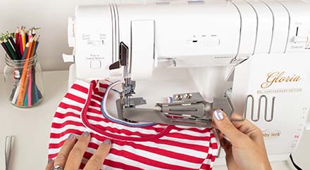 Coverstitch neck binding attachment